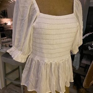 Pheasant top with gold metallic stitching